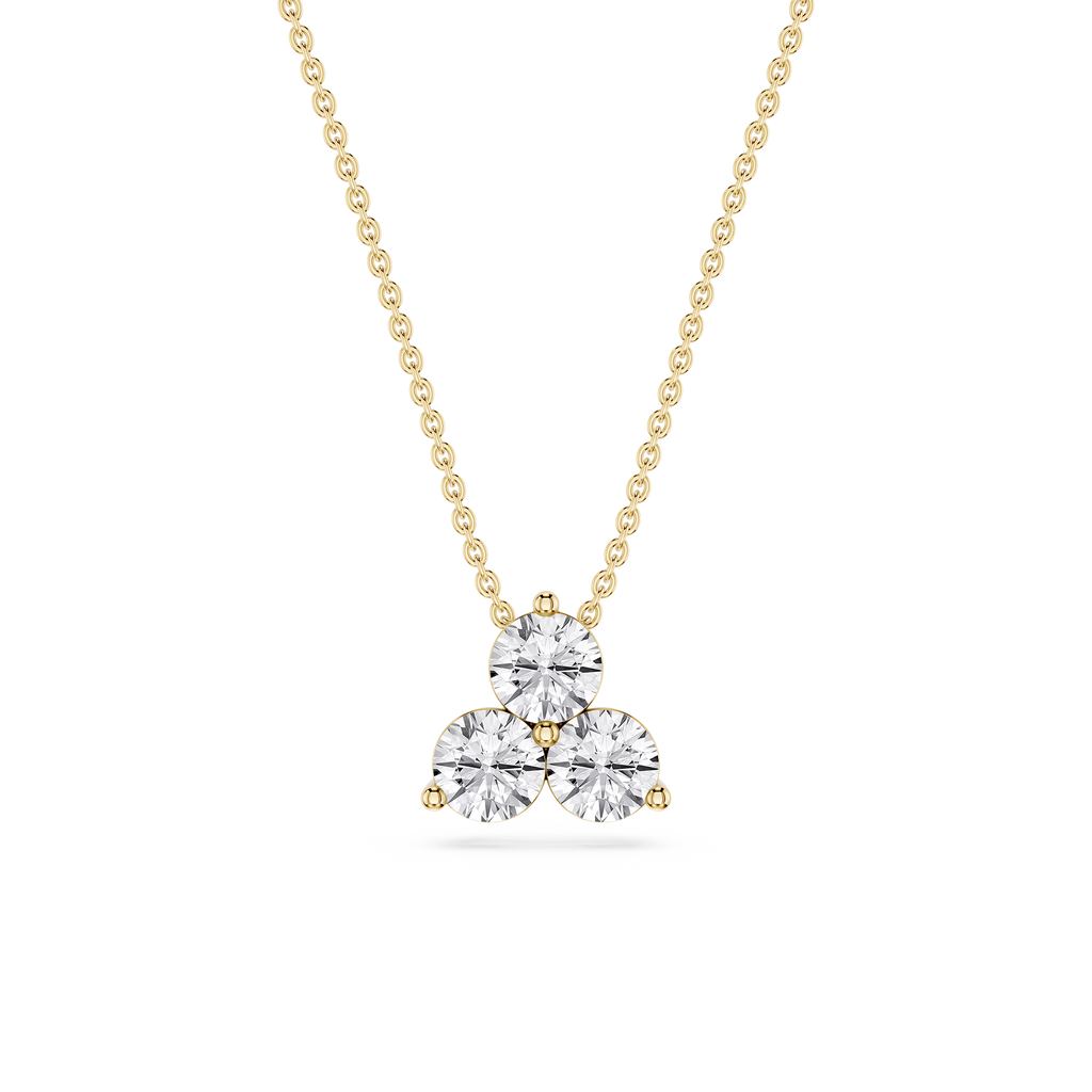 Gold necklace with a heart-shaped diamond pendant on a white background