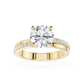 Gold ring with a large diamond and smaller diamonds on the band against a white background