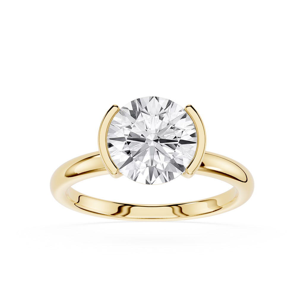 Gold ring with a diamond on a white background