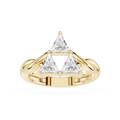 Gold ring with triangular diamond design on a white background