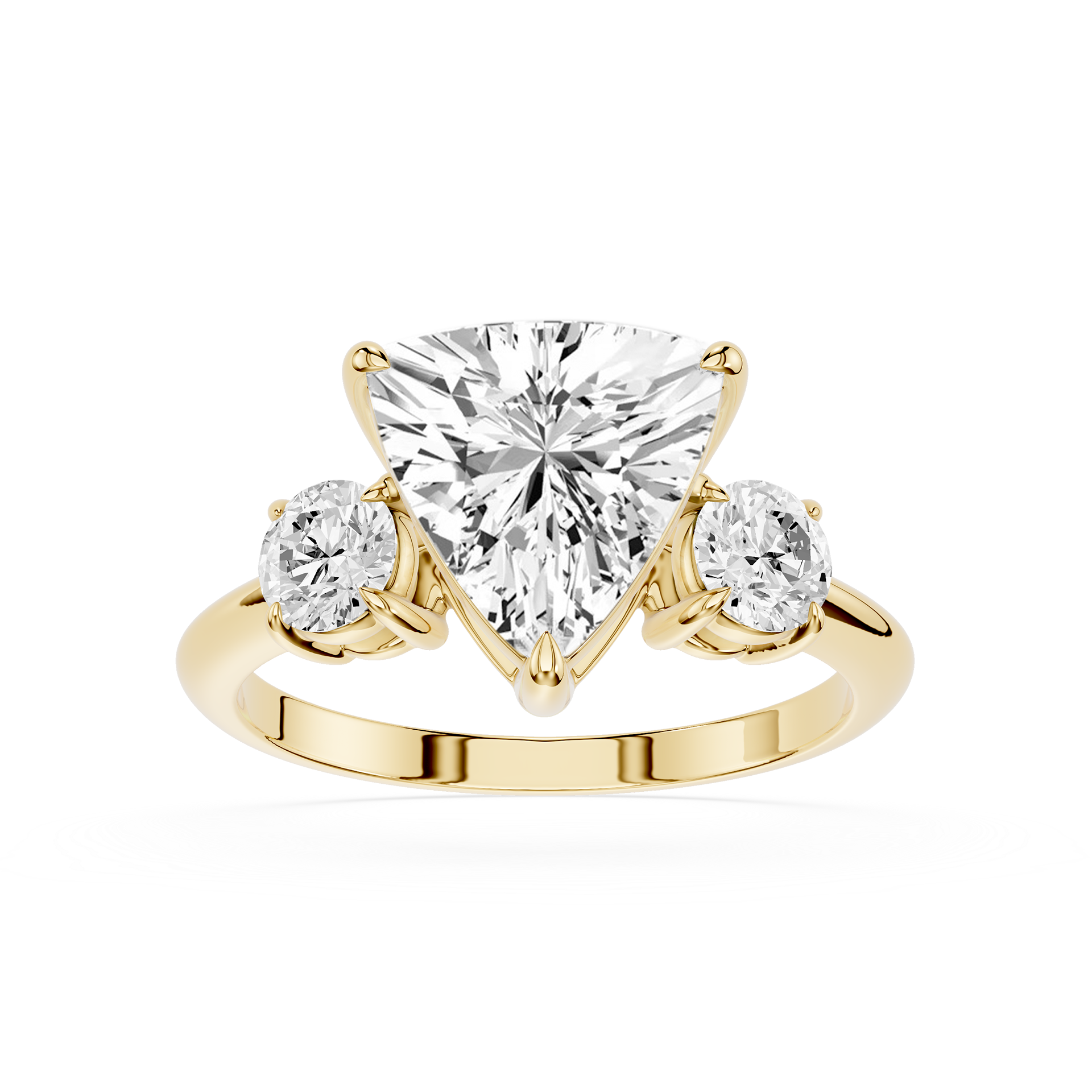 Gold ring with a heart-shaped diamond and two smaller diamonds on a white background