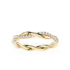 Gold ring with diamond accents on a white background
