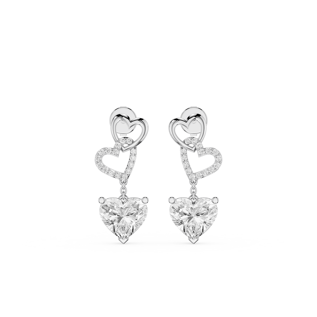 Heart-shaped earrings with clear gemstones on a white background