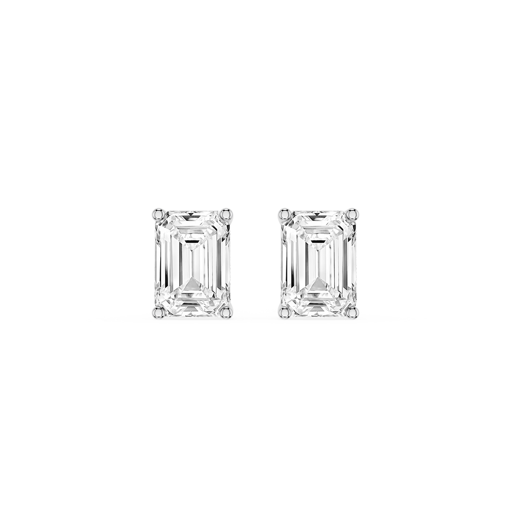 Pair of emerald-cut diamond stud earrings on a white background