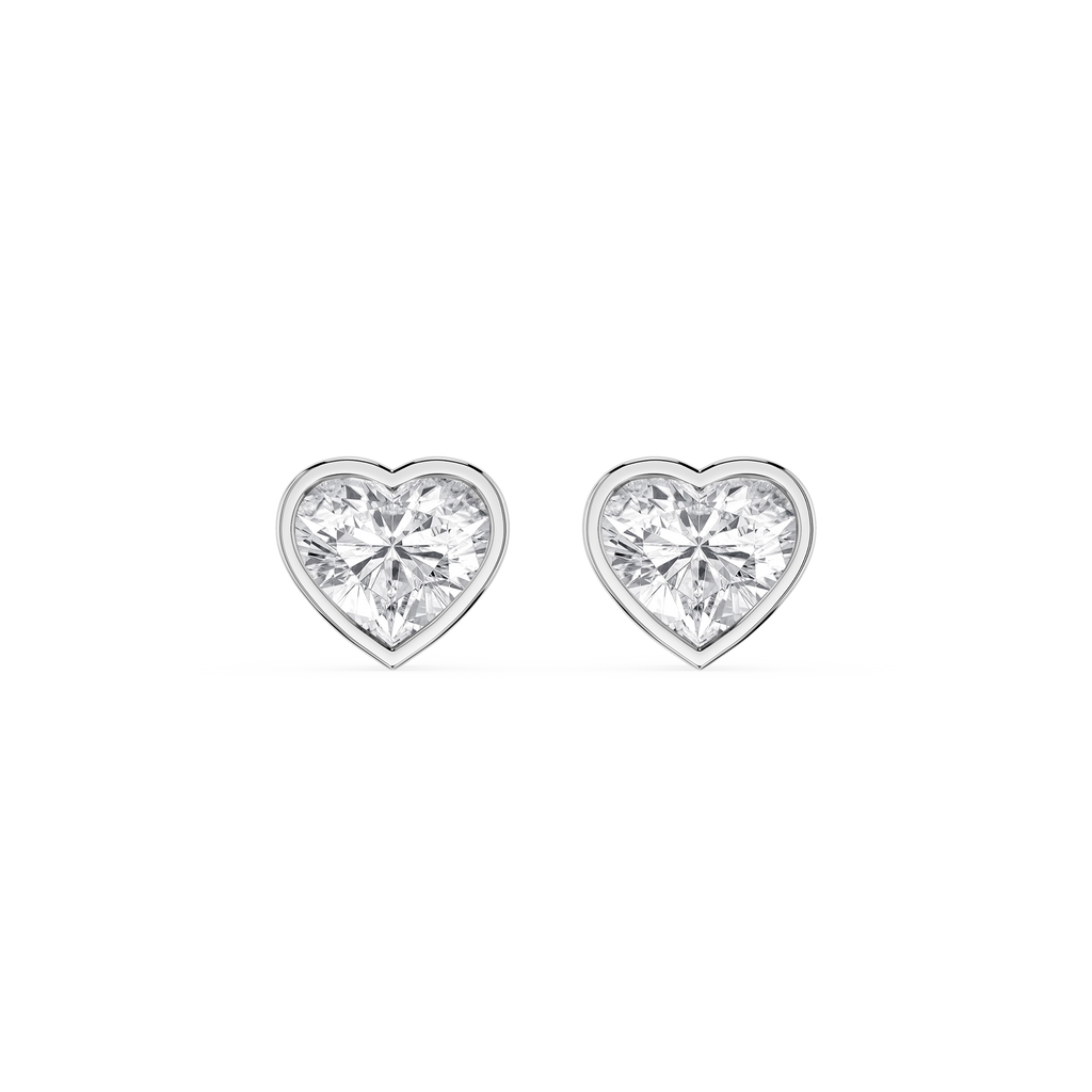 Heart-shaped diamond earrings on a white background