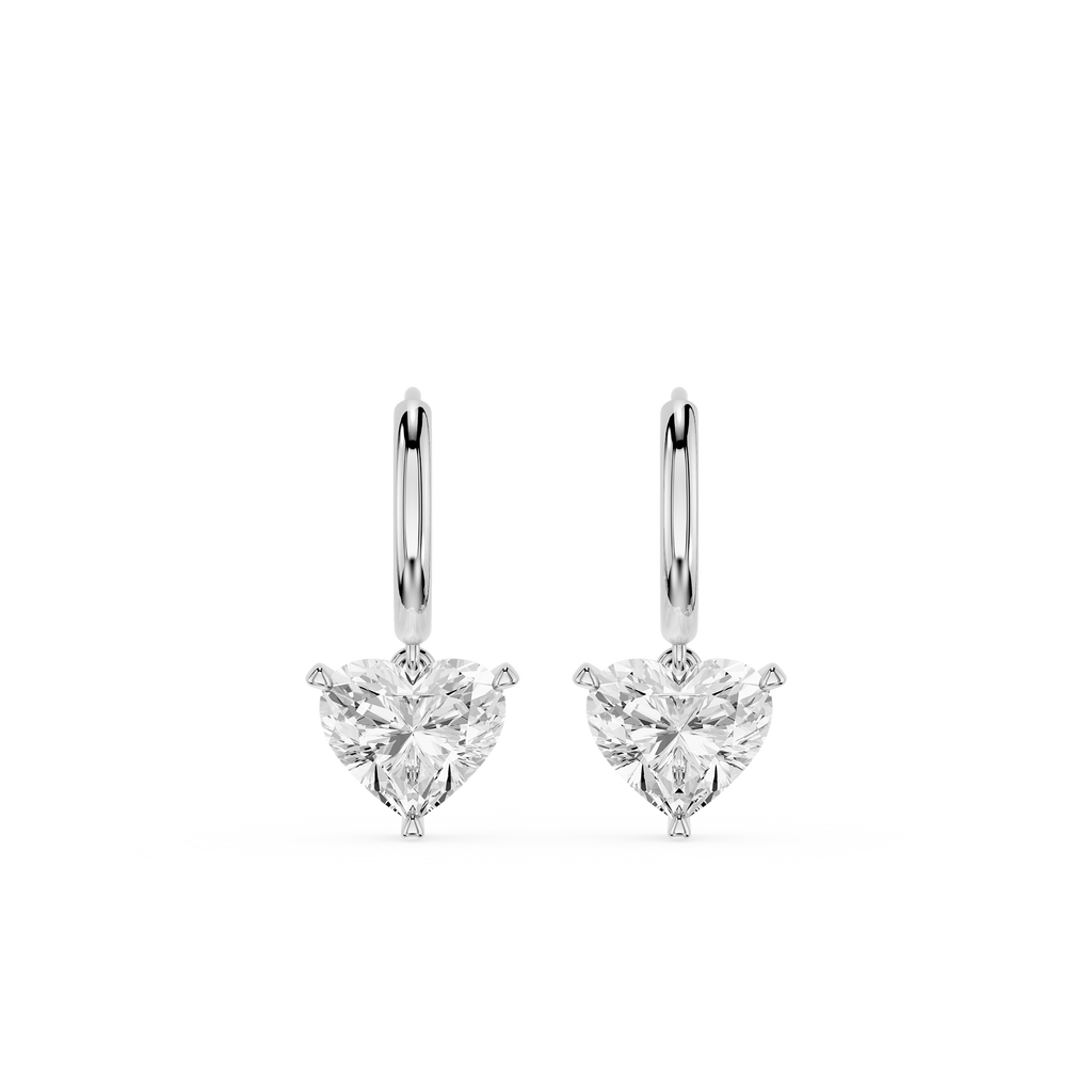 Pair of heart-shaped diamond earrings on a white background