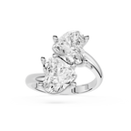 A Silver gold ring featuring two large pear-cut clear gemstones in a split-prong setting, shown on a clean white background.