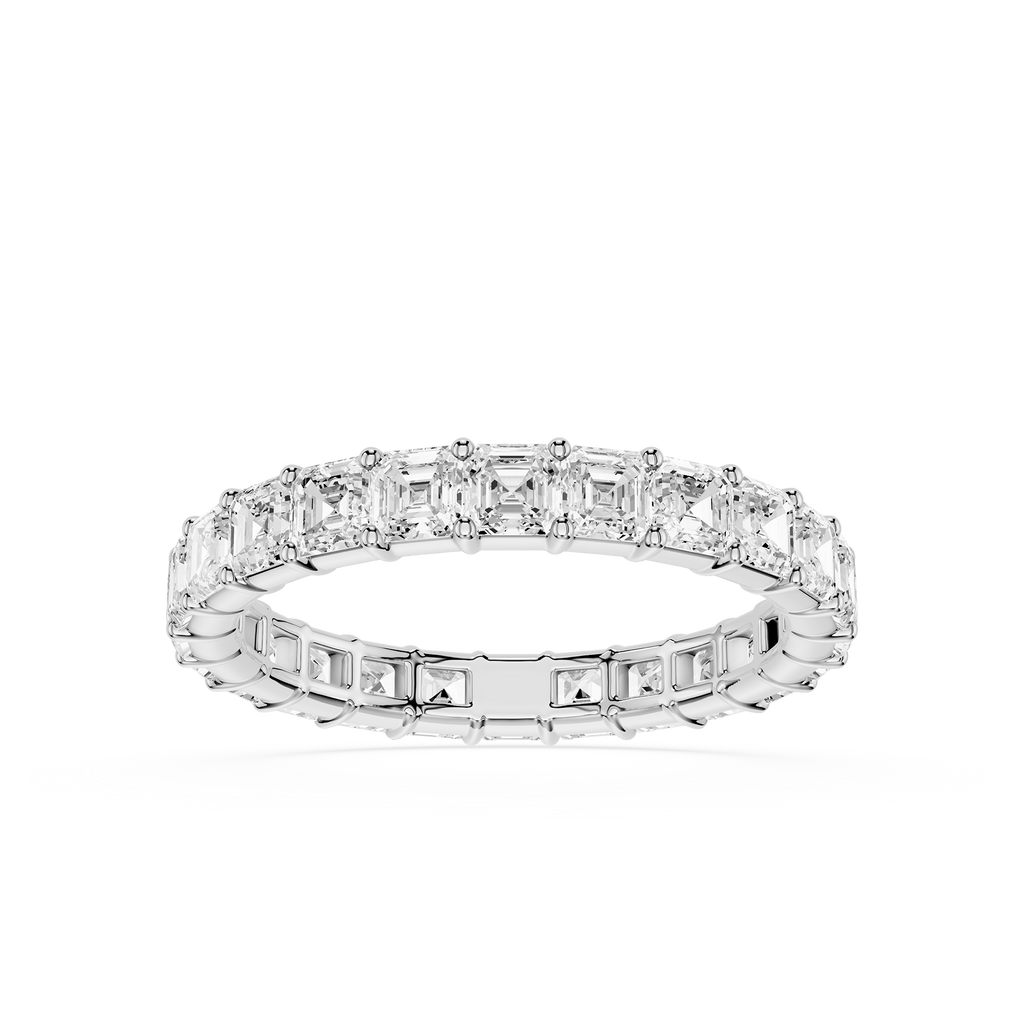 A Silver gold eternity ring featuring a continuous row of baguette-cut clear diamonds on the top and smaller round diamonds on the sides, set against a plain white background.