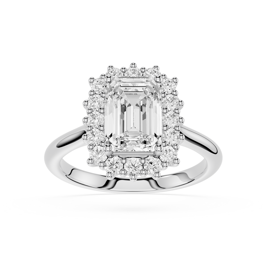 An emerald-cut halo ring featuring a central clear baguette diamond surrounded by a double halo of smaller round and marquise-cut diamonds, set in a polished silver-colored metal band on a white background.