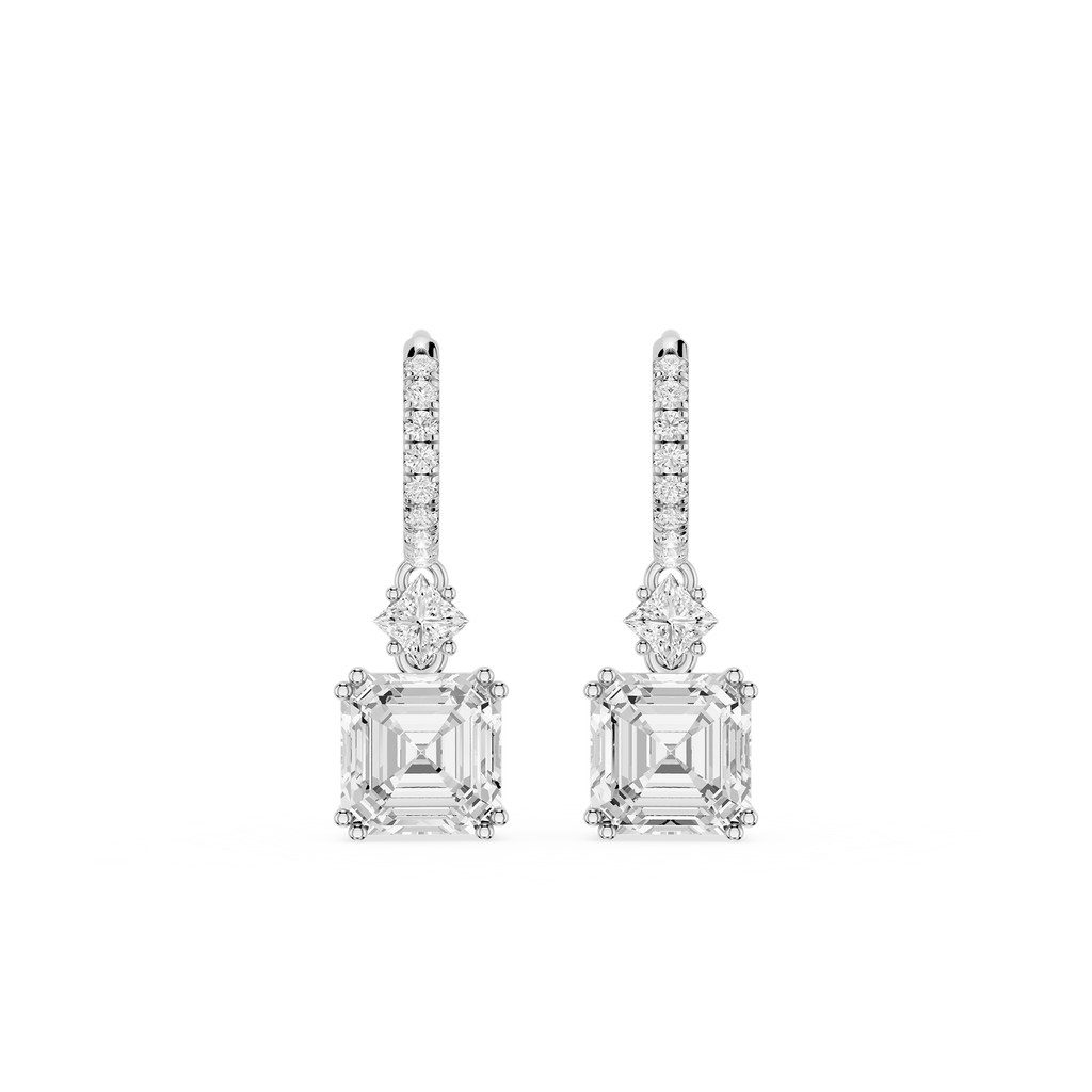 Pair of diamond earrings on a white background