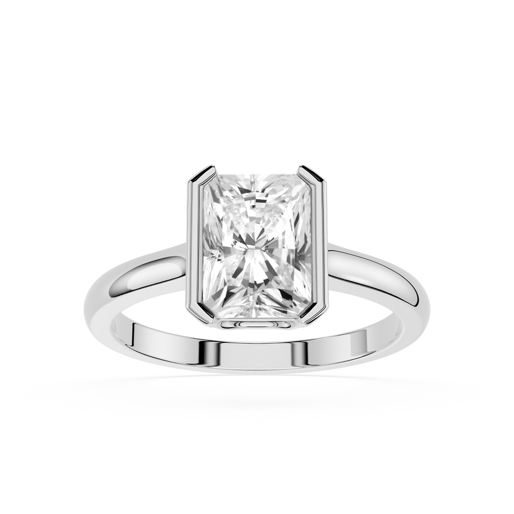 Diamond ring with a rectangular cut gemstone on a white background