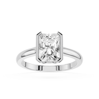 Diamond ring with a rectangular cut gemstone on a white background