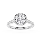 A round-cut diamond engagement ring in a polished silver-colored metal band with pavé-set diamonds along the shoulders, shown on a clean white background.