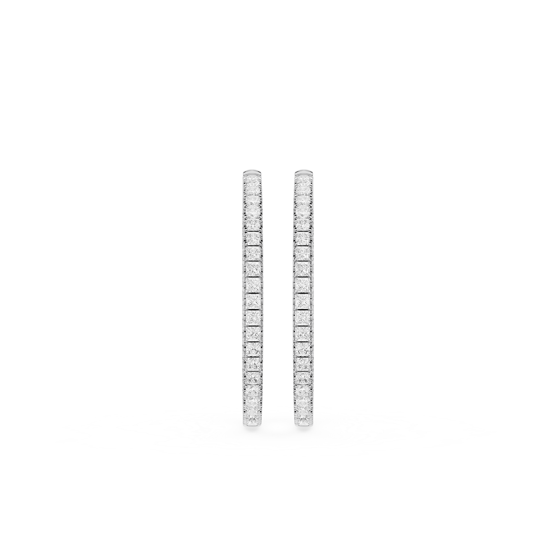 Pair of diamond hoop earrings on a white background