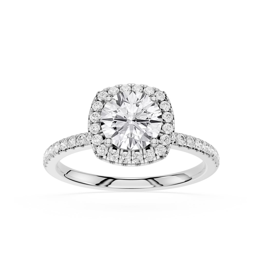 Diamond ring with a halo on a white background