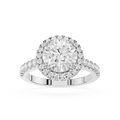 A silver-toned diamond engagement ring with a round-cut center stone, a halo of smaller diamonds, and a shank accented with pave diamonds, shown on a clean white background.