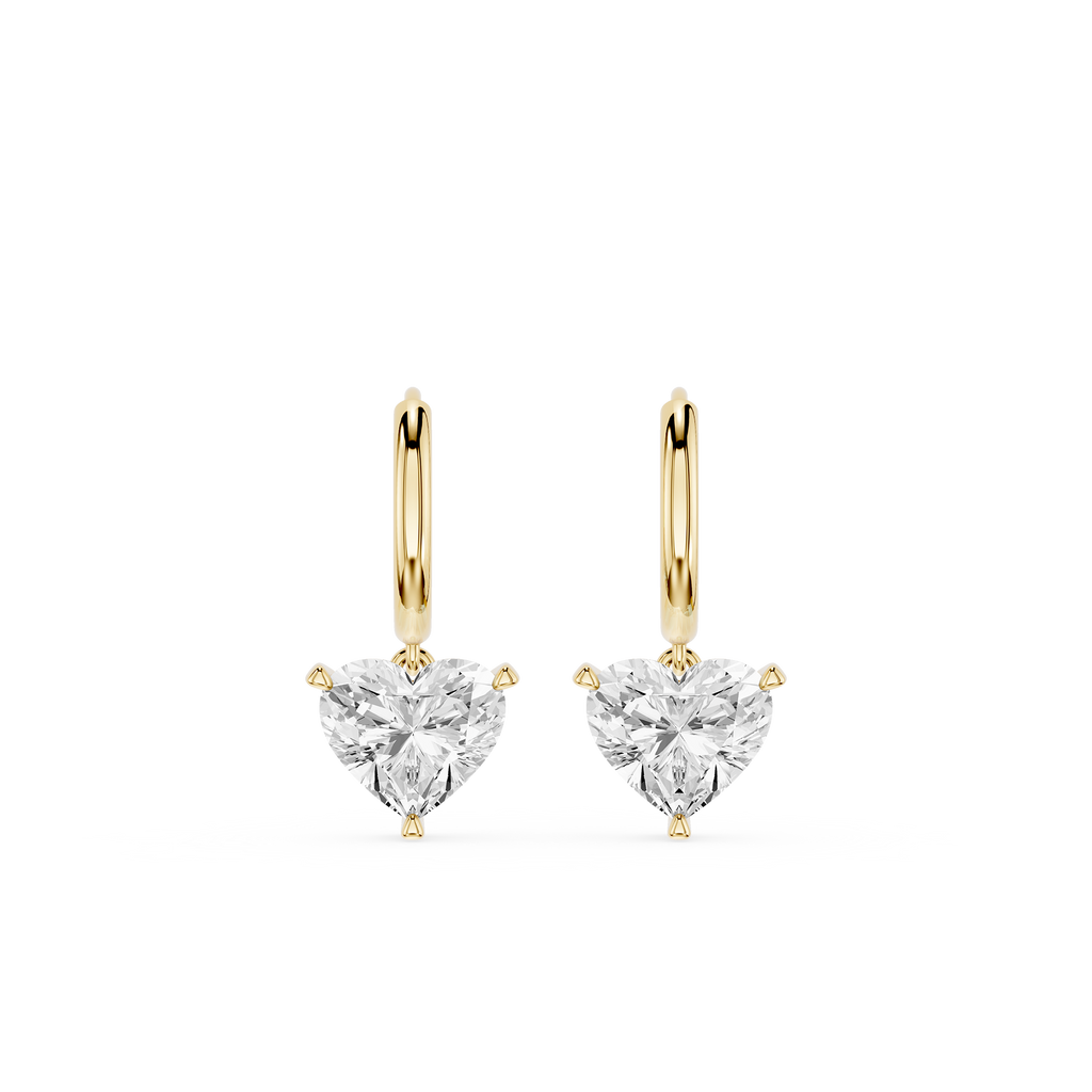 Gold hoop earrings with clear heart-shaped gemstones on a white background