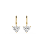 Gold hoop earrings with clear heart-shaped gemstones on a white background
