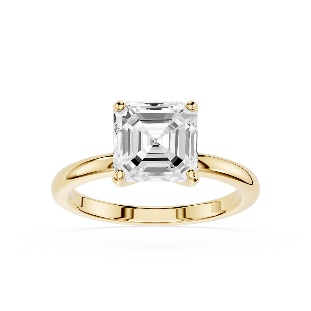 Gold ring with a large diamond on a white background