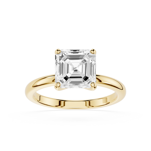 Gold ring with a large diamond on a white background