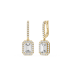 Gold earrings with emerald-cut gemstones on a white background