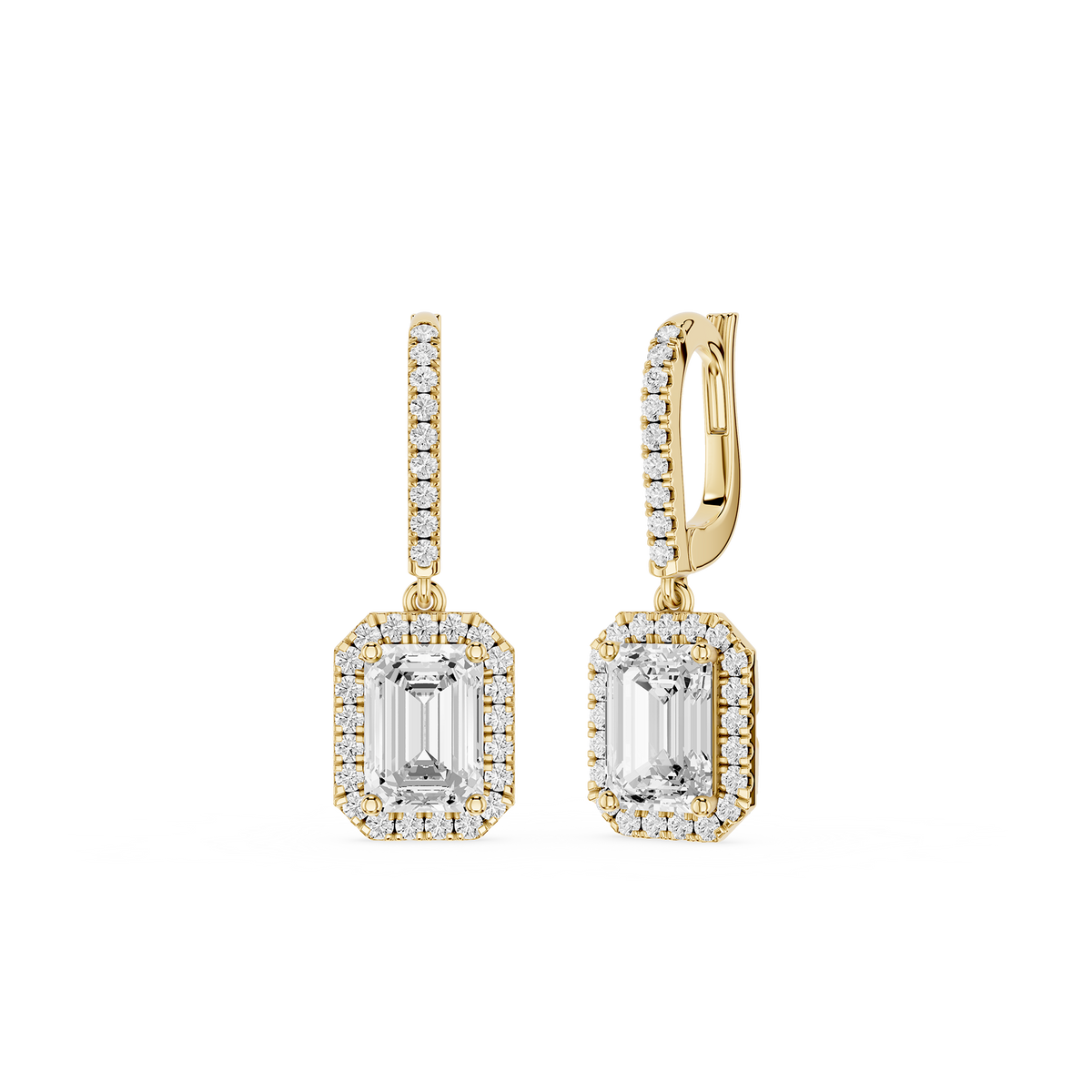 Gold earrings with emerald-cut gemstones on a white background