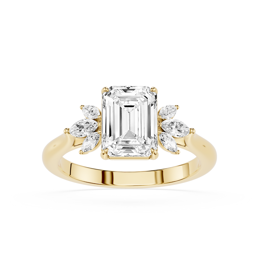 A yellow gold engagement ring featuring a large emerald-cut center diamond flanked by smaller marquise-cut side diamonds, set on a polished band against a white background.