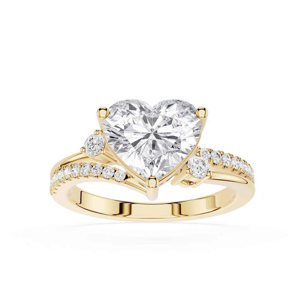 A yellow gold heart-shaped diamond engagement ring with a pavé band, shown on a clean white background.
