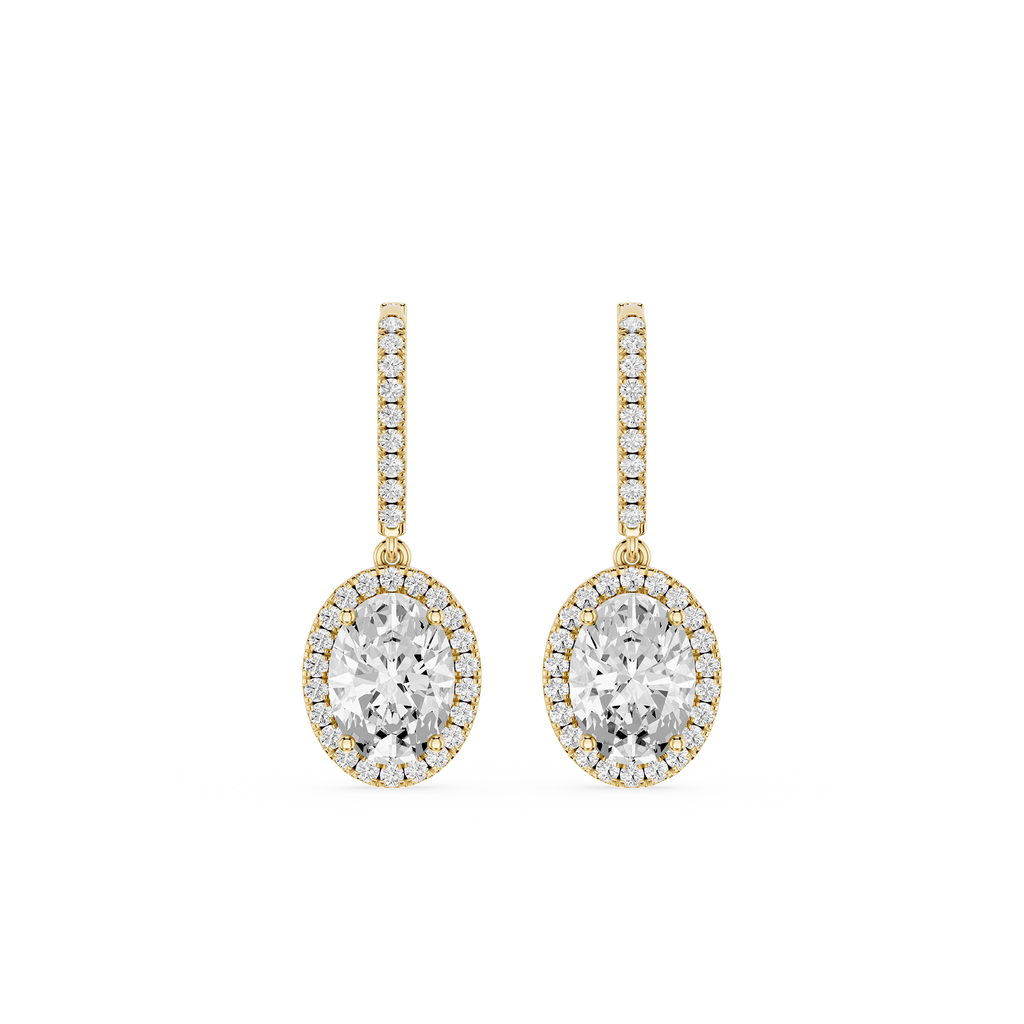 Gold and diamond earrings on a white background