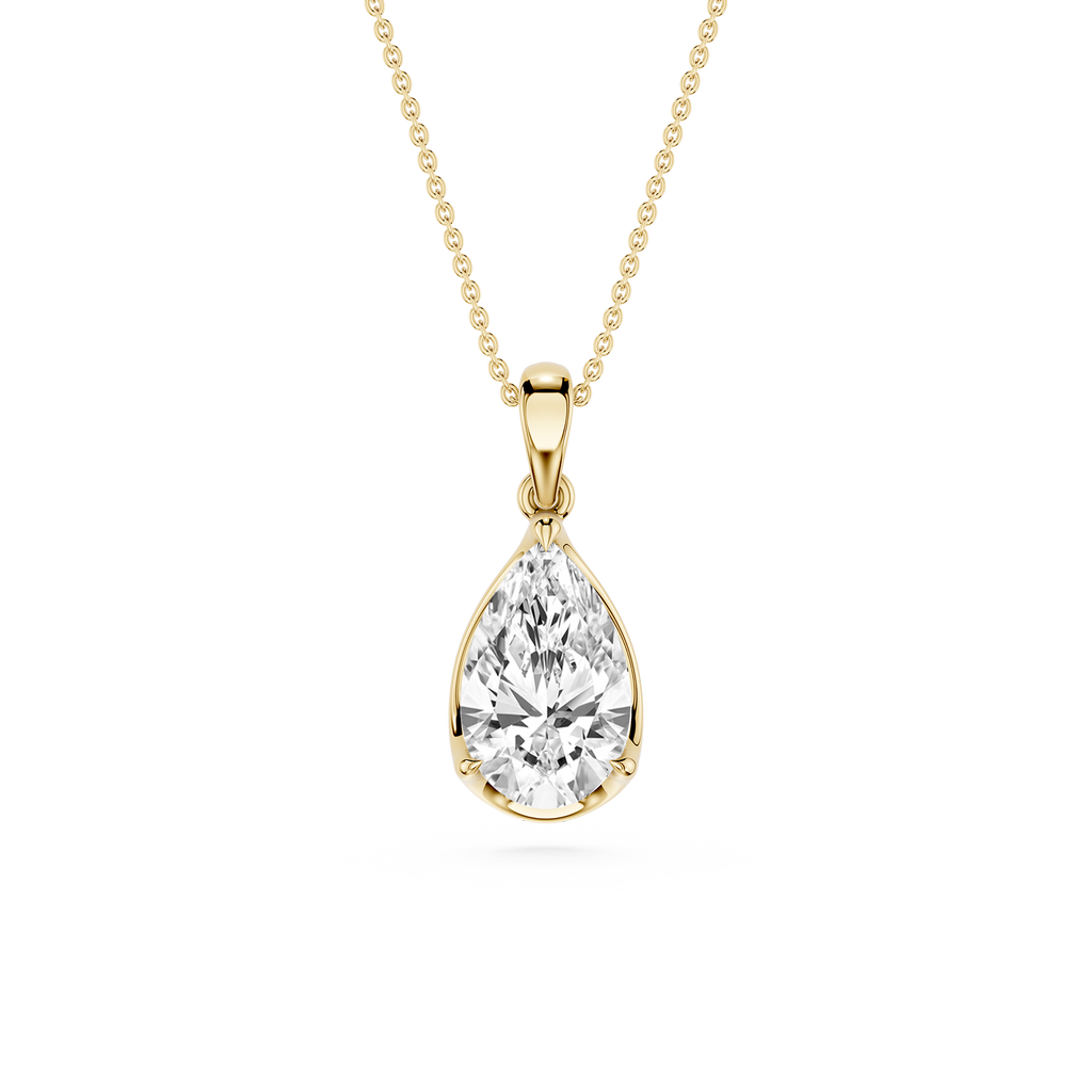 Gold necklace with a teardrop-shaped diamond pendant on a white background