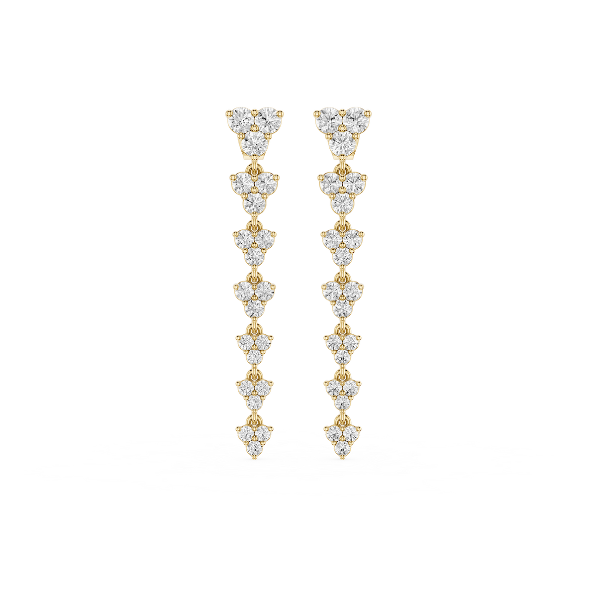Gold and diamond earrings on a white background