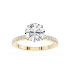A yellow gold engagement ring featuring a round brilliant-cut diamond center stone and a pavé-set diamond band, shown on a clean white background.