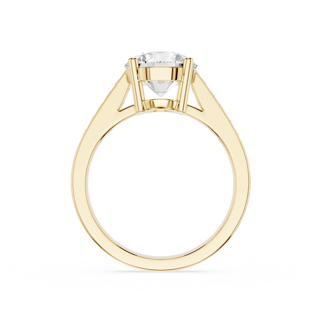 A yellow gold solitaire engagement ring with a round brilliant-cut diamond center stone, shown on a clean white background.