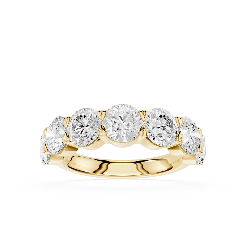 A yellow gold five-stone diamond ring with round brilliant-cut diamonds set in a row on a polished band, shown against a solid white background.