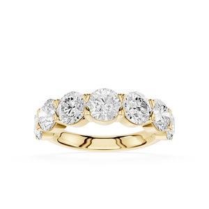 A yellow gold five-stone diamond ring with round brilliant-cut diamonds set in a row on a polished band, shown against a solid white background.