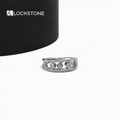 Geometric diamond anniversary ring in yellow gold with circular diamond settings framed by two rows of small round stones