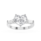 Heart-shaped diamond ring with two side stones on a white background