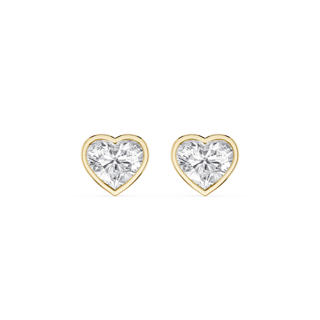 Heart-shaped diamond earrings with gold settings on a white background
