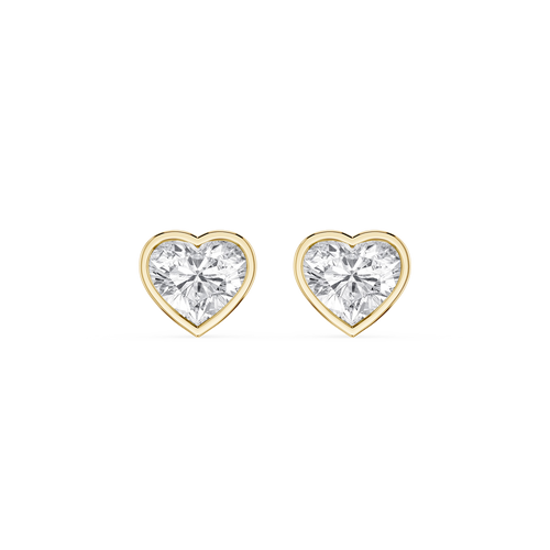 Heart-shaped diamond earrings with gold settings on a white background