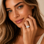 Woman wearing a diamond ring on a neutral background