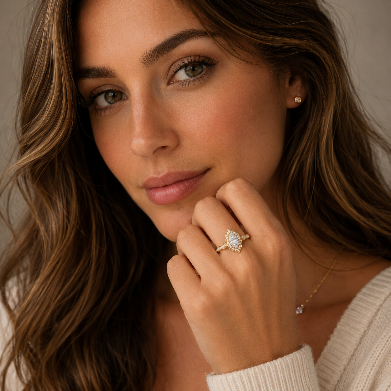 Woman wearing a diamond ring with a neutral background