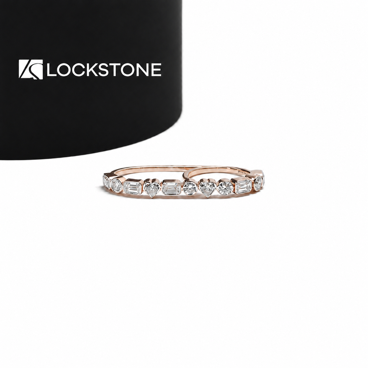 Rose gold multi shape lab grown diamond wedding band featuring alternating heart, emerald and round cut bezel set diamonds