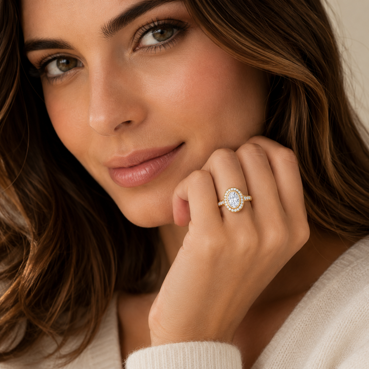 Woman wearing a diamond ring, close-up of face and hand