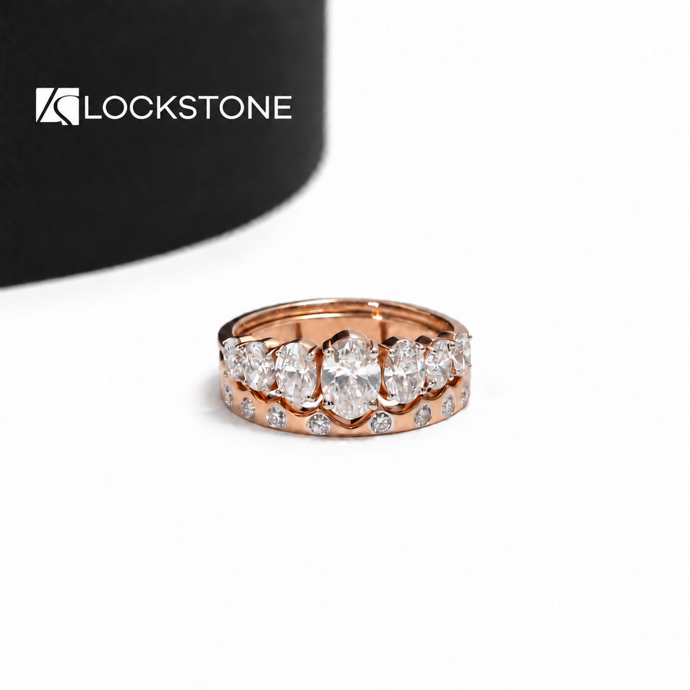 Rose gold five stone oval lab grown diamond anniversary ring paired with a round bezel set diamond wedding band