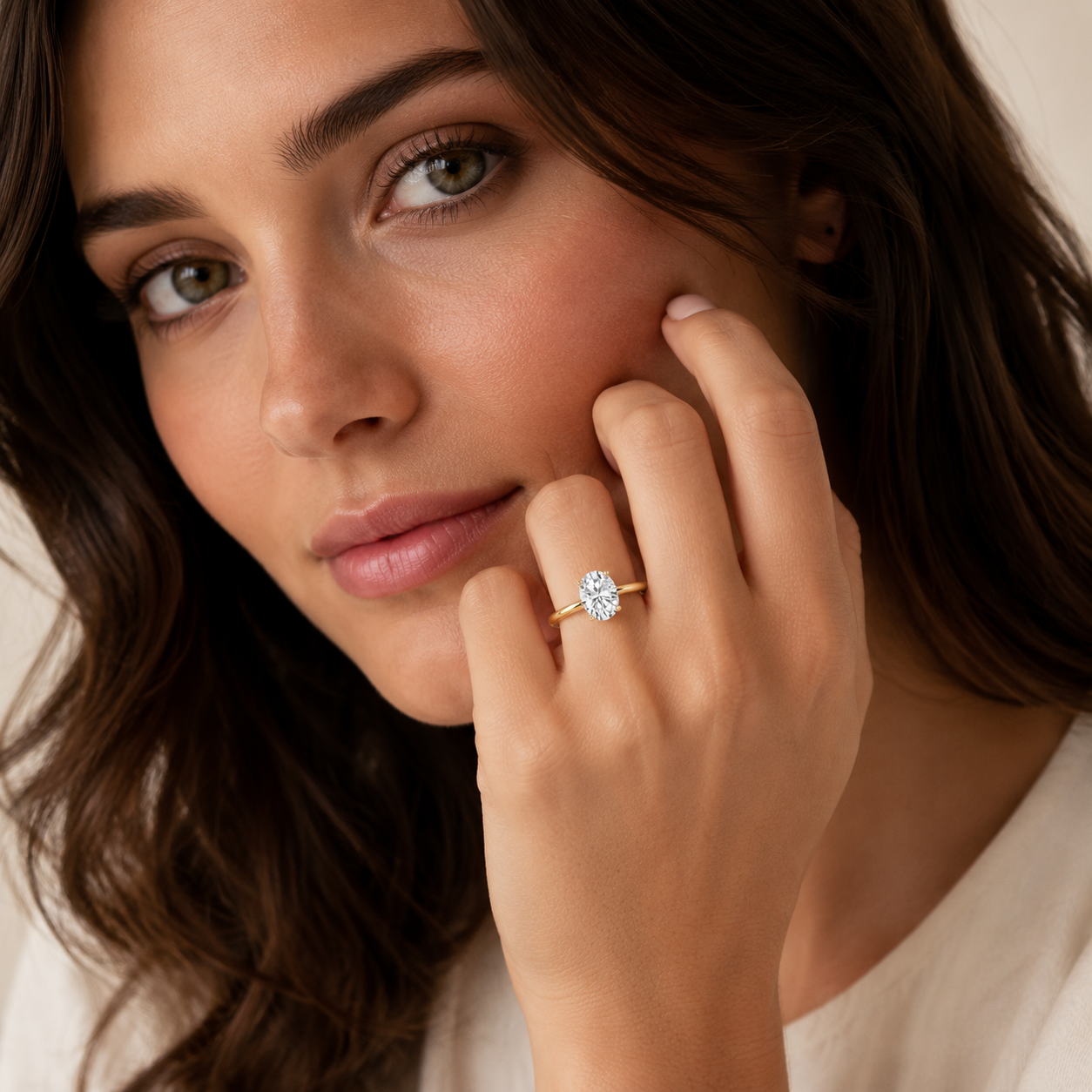 Woman wearing a diamond ring with a soft focus background