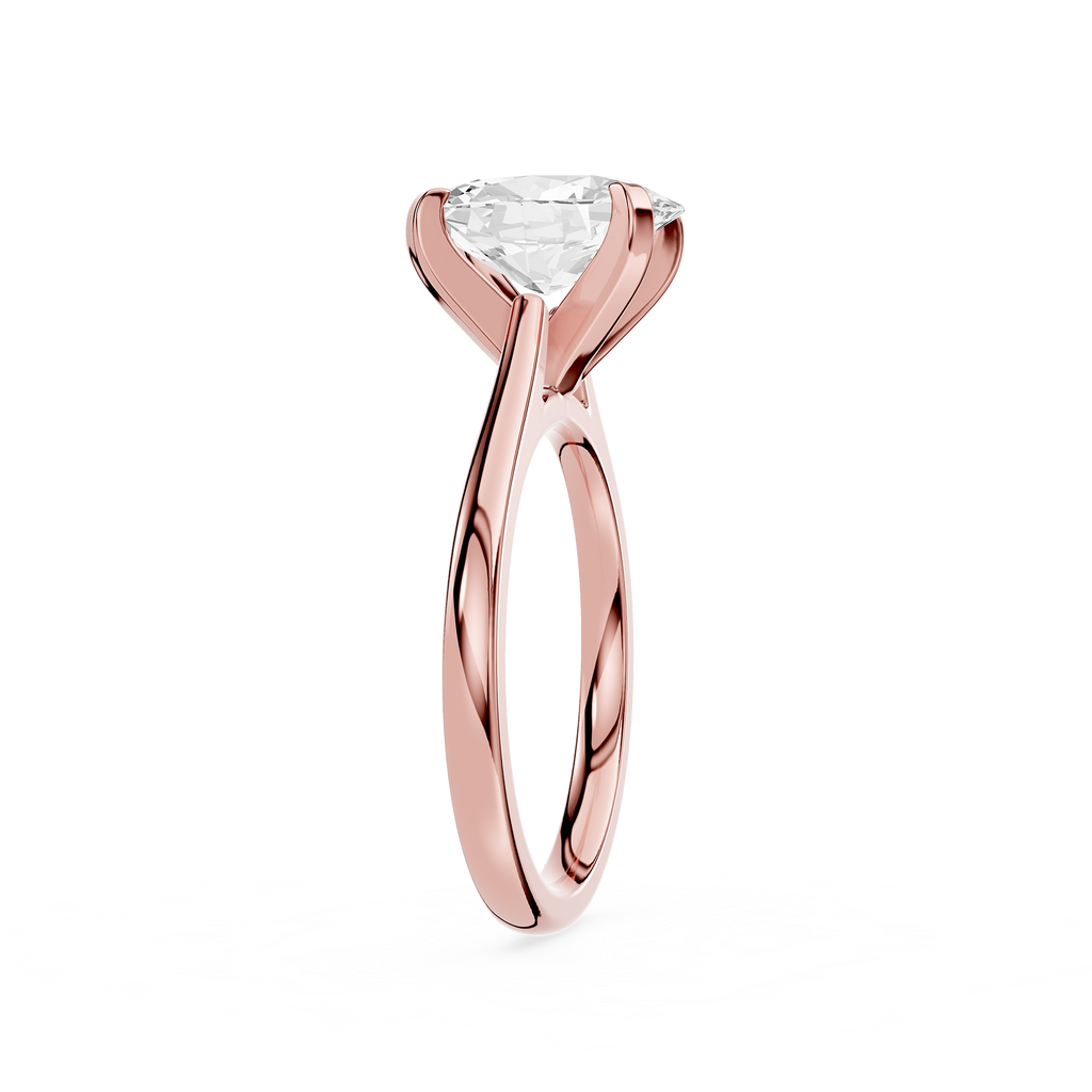 Rose gold ring with a clear gemstone on a white background