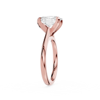Rose gold ring with a clear gemstone on a white background