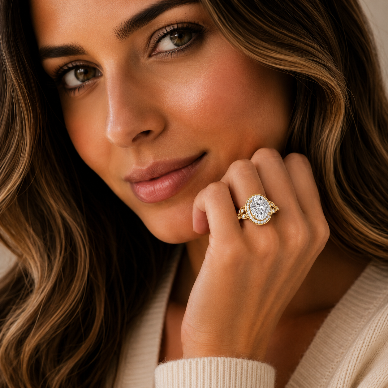 Woman wearing a diamond ring with a neutral background