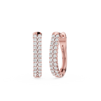 Rose gold hoop earrings with diamond accents on a white background
