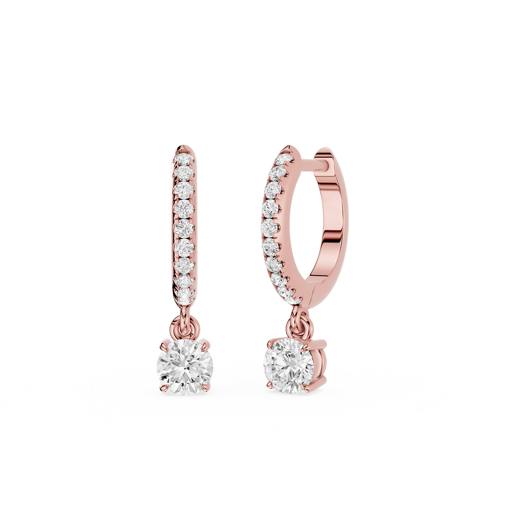 Rose gold hoop earrings with round gemstones on a white background